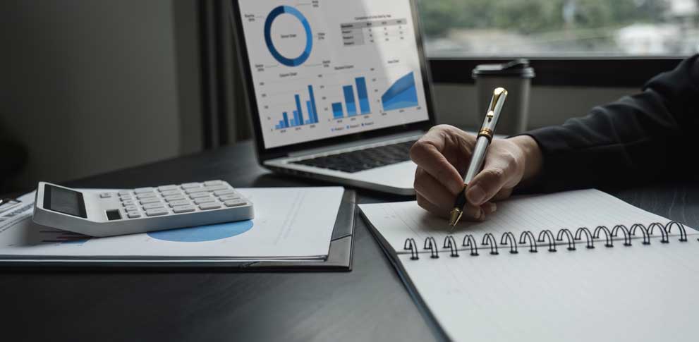 Accountant works charts graphs showing organizational results